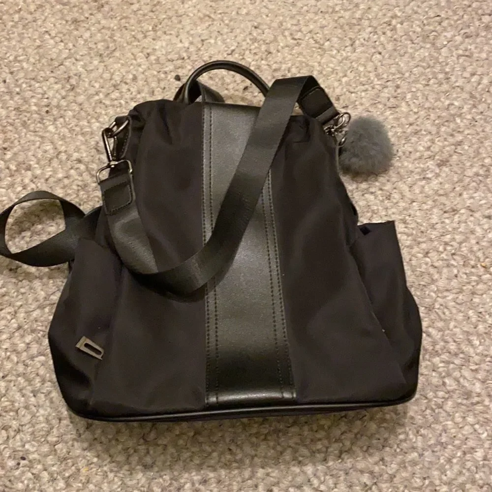 YaLuxe black nylon backpack.